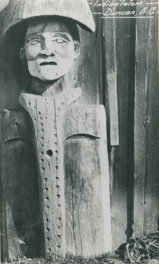 Close-up view of a carved house post.