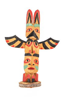 Miniature wooden thunderbird totem pole