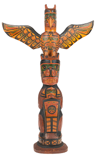 Small carved totem depicting a thunderbird and bear